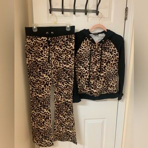 Bebe, women sport track suit , top and pants .
